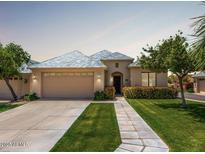 Charming single-story home with a tile roof, manicured lawn, and welcoming curb appeal at 16540 E El Lago Blvd # 2, Fountain Hills, AZ 85268