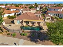 Inviting pool with a wrought iron fence and desert landscaping at 2111 E Azalea Dr, Chandler, AZ 85286