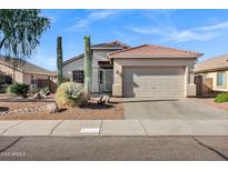 Charming single-story home with a low-maintenance desert landscape at 2272 W Jasper Butte Dr, Queen Creek, AZ 85144