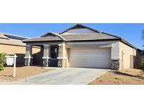 Charming single-story home featuring stone accents, a two-car garage, and a well-manicured front yard at 2745 W Jessica Ln, Phoenix, AZ 85041