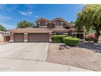Charming two-story home with a three-car garage and well-maintained landscaping at 30 W Sheffield Ave, Gilbert, AZ 85233