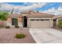 Charming single-story home with a well-maintained front yard and a neutral color palette at 4152 S Bandit Ct, Gilbert, AZ 85297