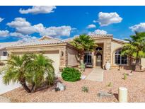 Charming single-story home featuring desert landscaping, a two-car garage, and a welcoming front entrance at 22351 N 67Th Dr, Glendale, AZ 85310