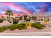 Expansive ranch home with desert landscaping and dramatic sunset skies at 3733 E Kachina Dr, Phoenix, AZ 85044