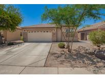 Charming single-story home with a two-car garage and desert landscaping at 38662 N La Grange Ln, San Tan Valley, AZ 85140