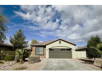 Charming single-story home with a two-car garage, low-maintenance landscaping and neutral-tone stucco exterior at 4440 S Leisure Way, Gilbert, AZ 85297