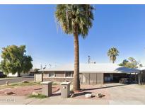 Charming single-story home featuring desert landscaping and a spacious carport at 7202 N 36Th Ave, Phoenix, AZ 85051