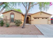Charming single-story home with a two-car garage and well-maintained landscaping at 7607 W Keim Dr, Glendale, AZ 85303