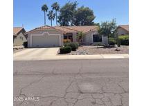 Charming home with tile roof and well-manicured desert landscaping at 9807 W Mcrae Way, Peoria, AZ 85382
