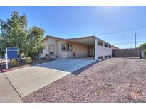 Charming single-story home with covered parking and low-maintenance desert landscaping at 1855 N Rim Rock Dr, Casa Grande, AZ 85122