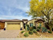 Charming single-Gathering home with desert landscaping and a two-car garage, showcasing curb appeal at 31107 N 27Th Ave, Phoenix, AZ 85085