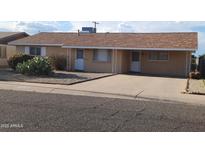 Charming single-story home with neutral-colored siding and well-kept landscaping at 4008 W El Caminito Dr, Phoenix, AZ 85051