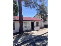 Cozy single-story home with a red tile roof, front walkway, and small landscaped area near the entry at 15610 N 29Th St # 4, Phoenix, AZ 85032