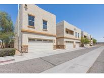 View of exterior of the home and garages at 15818 N 25Th St # 124, Phoenix, AZ 85032