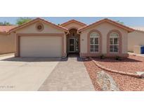 Charming single-story home with a well-maintained front yard and covered entryway at 1917 E Lindrick Dr, Chandler, AZ 85249