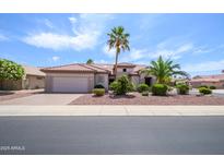 Charming single-story home featuring desert landscaping and a tile roof at 20039 N Hearthstone Dr, Surprise, AZ 85374