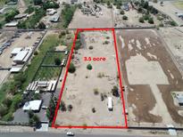 This aerial view shows a large 3.5 acre lot, bordered in red, with plenty of space for development at 40458 N Prince Ave, San Tan Valley, AZ 85140