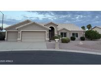 Charming single-story home boasts a three-car garage and well-maintained desert landscaping at 4081 N 156Th Dr, Goodyear, AZ 85395