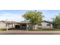 Charming single story home with a mature shade tree and fenced front yard in a quiet residential neighborhood at 6633 N 19Th Dr, Phoenix, AZ 85015