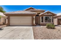 Charming single-story home with a two-car garage and desert landscaping in a sunny setting at 16120 N 86Th Ln, Peoria, AZ 85382
