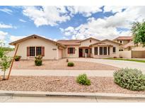 Charming single-story home showcasing well-manicured landscaping and a welcoming entrance at 20423 S 186Th St, Queen Creek, AZ 85142