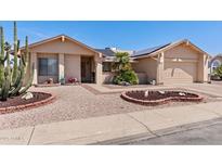 Charming single-story home featuring well-maintained desert landscaping and a two-car garage at 2363 Leisure World --, Mesa, AZ 85206