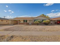 Charming single-story home featuring a covered carport and low-maintenance landscaping at 3632 W Mariposa St, Phoenix, AZ 85019
