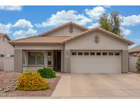 Charming single-story home featuring a well-maintained front yard and a two-car garage at 3724 E Derringer Way, Gilbert, AZ 85297