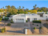 Beautiful single-story home with a well-manicured front yard and attached two-car garage at 39 E Tam Oshanter Dr, Phoenix, AZ 85022