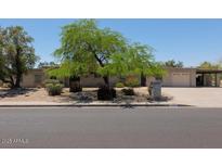 Spacious single-story home featuring a large front yard and a two-car garage at 7232 N 22 Nd St, Phoenix, AZ 85020