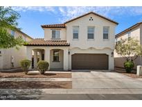 Charming two-story home with a well-maintained lawn and a two-car garage, enhancing curb appeal at 737 E Harwell Rd, Phoenix, AZ 85042
