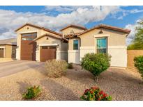 Attractive single-Gathering home showing well maintained landscaping and a spacious three-car garage at 7829 W Warner St, Phoenix, AZ 85043