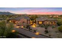 Stunning exterior elevation showcasing the home's architecture, desert landscaping, and inviting entryway at 9936 E Winter Sun Dr, Scottsdale, AZ 85262