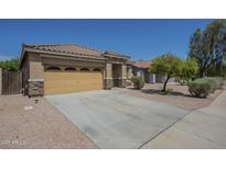 Charming single-story home with well-maintained landscaping and a two-car garage at 11625 N 153Rd Dr, Surprise, AZ 85379