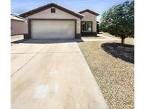 Charming single-story home featuring a two-car garage and low-maintenance desert landscaping for easy upkeep at 14065 W Cornerstone Trl, Surprise, AZ 85374