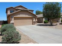 Two-story home featuring a two-car garage, low maintenance desert landscaping, and a tile roof at 2434 E San Manuel Rd, San Tan Valley, AZ 85143