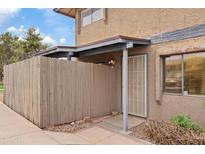 Inviting exterior with a private, fenced courtyard and security door at 286 W Palomino Dr # 103, Chandler, AZ 85225