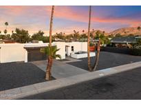 Charming exterior of a home with desert landscaping, showcasing a unique curb appeal at 10245 N 34Th Pl, Phoenix, AZ 85028