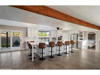 Spacious kitchen with an island and counter-height seating, perfect for dining and entertaining at 10245 N 34Th Pl, Phoenix, AZ 85028