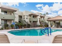A refreshing community pool with lounge chairs offers a perfect spot for relaxation and leisure at 1825 W Ray Rd # 2132, Chandler, AZ 85224