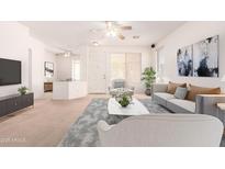 Spacious living room featuring neutral walls, plush carpeting, and plenty of natural light at 3016 N 109Th Ave, Avondale, AZ 85392