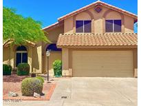 Charming two-story home featuring a two-car garage and well-maintained landscaping at 4306 E Amberwood Dr, Phoenix, AZ 85048