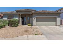 Charming single-story home featuring a well-manicured front yard and a two-car garage at 6422 W Brookhart Way, Phoenix, AZ 85083