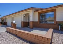 Charming single-story home with a well-manicured front yard and a one-car garage at 8261 E Keats Ave # 396, Mesa, AZ 85209