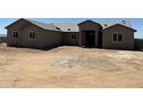 Newly built single Gathering home with a neutral color scheme and simple landscaping awaiting customization at 9485 W Sandstone Mountain Dr, Casa Grande, AZ 85194