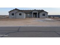 New construction featuring a neutral colored stucco and ample space for landscaping at 9485 W Sandstone Mountain Dr, Casa Grande, AZ 85194