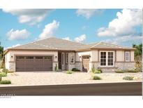 Charming single-story home with stone accents, well-manicured desert landscaping and a two-car garage at 20274 W Monterey Way, Buckeye, AZ 85396