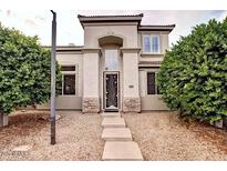 Charming two-story home with neutral tones, arched entry, and manicured landscaping at 2308 S Bernard --, Mesa, AZ 85209