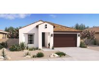 Charming single-story home with a brown roof, neutral stucco, a two-car garage and professionally landscaped front yard at 23443 W Albeniz Pl, Buckeye, AZ 85326