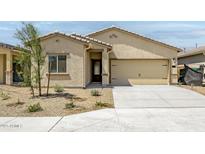 Charming single-story home featuring a two-car garage and low maintenance desert landscaping at 24571 W St Anne Ave, Buckeye, AZ 85326